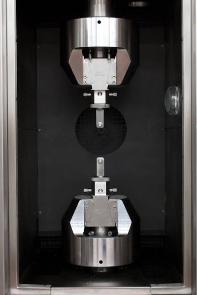 Extended Hydraulic Wedge Grips with Test Fixture Attached