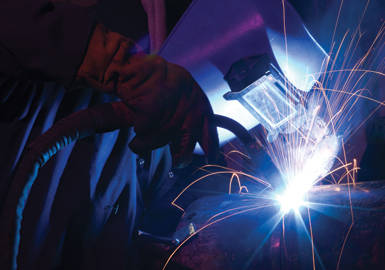 | Instron Welder in a full mask, joining materials