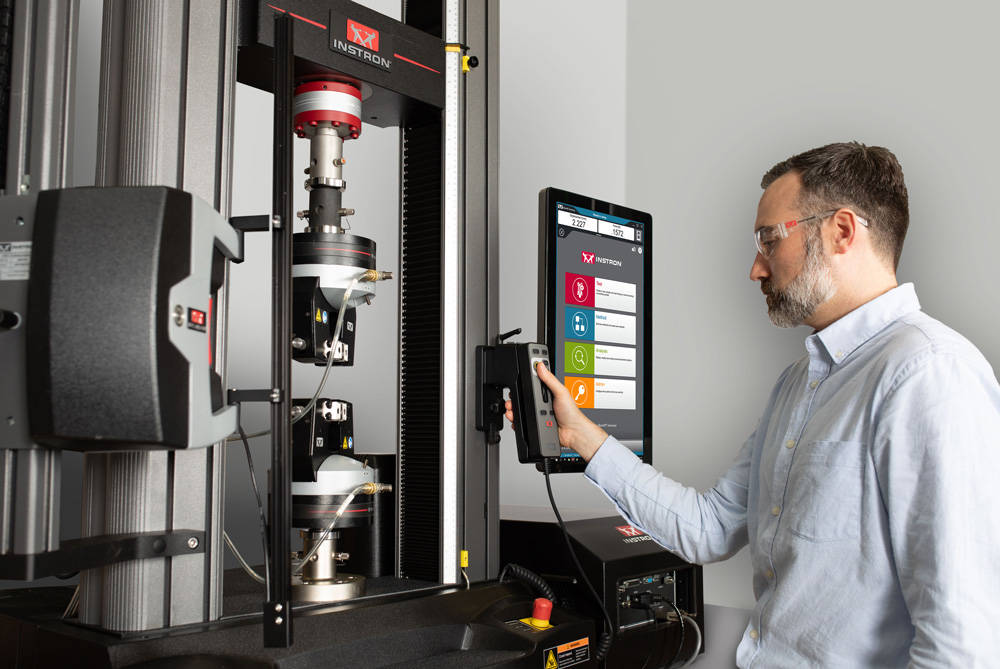 Operator Using Retrofitted Universal Testing System