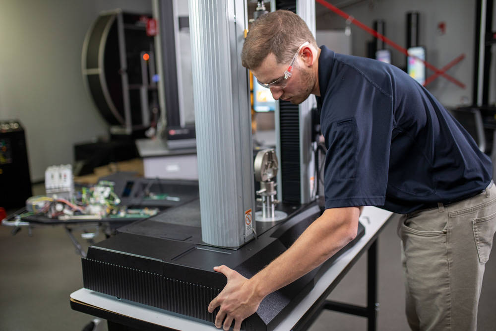 Service Engineer Performing a Universal Testing System Retrofit