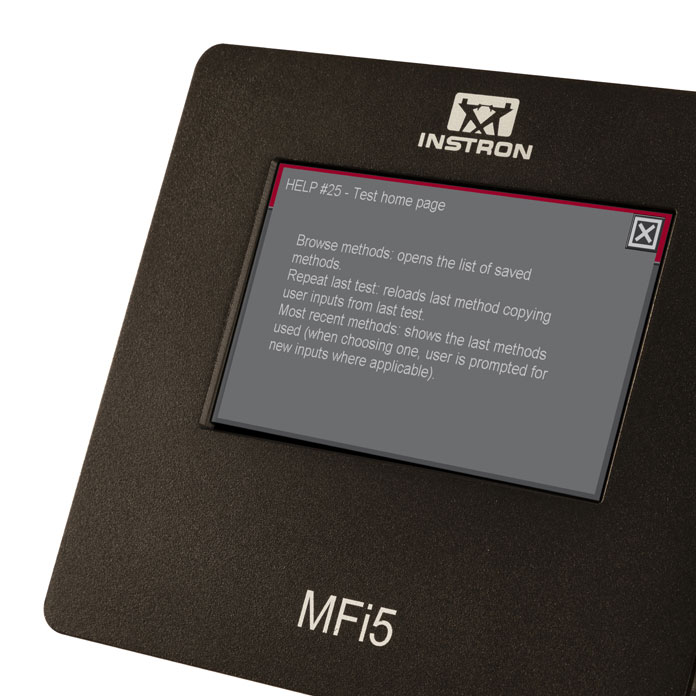 | Instron Pannello di controllo Instron MF15 con un piccolo display che mostra il testo 'HELP #25 - Pagina iniziale del test'.