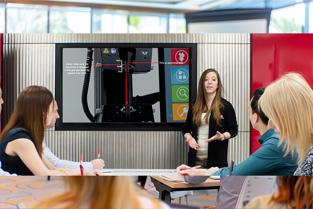 Instron instructor presenting Bluehill Universal software on a large display screen to training course attendees at Instron High Wycombe