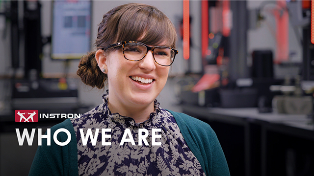 | Instron Smiling woman with glasses in a tech lab, overlay text says 'WHO WE ARE' beside the Intron logo (Instruments company).