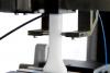 Biaxial extensometer testing a plastic specimen